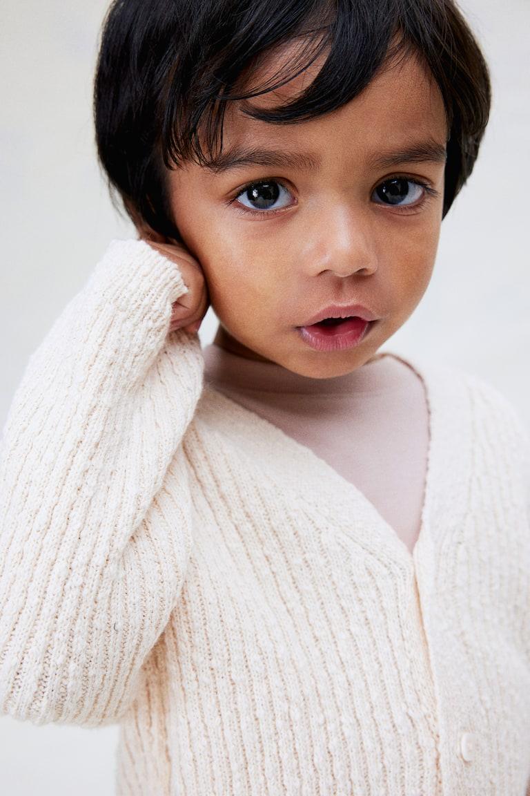H&M Oversized Cardigan aus Boucléstrick Riesige Rabatte