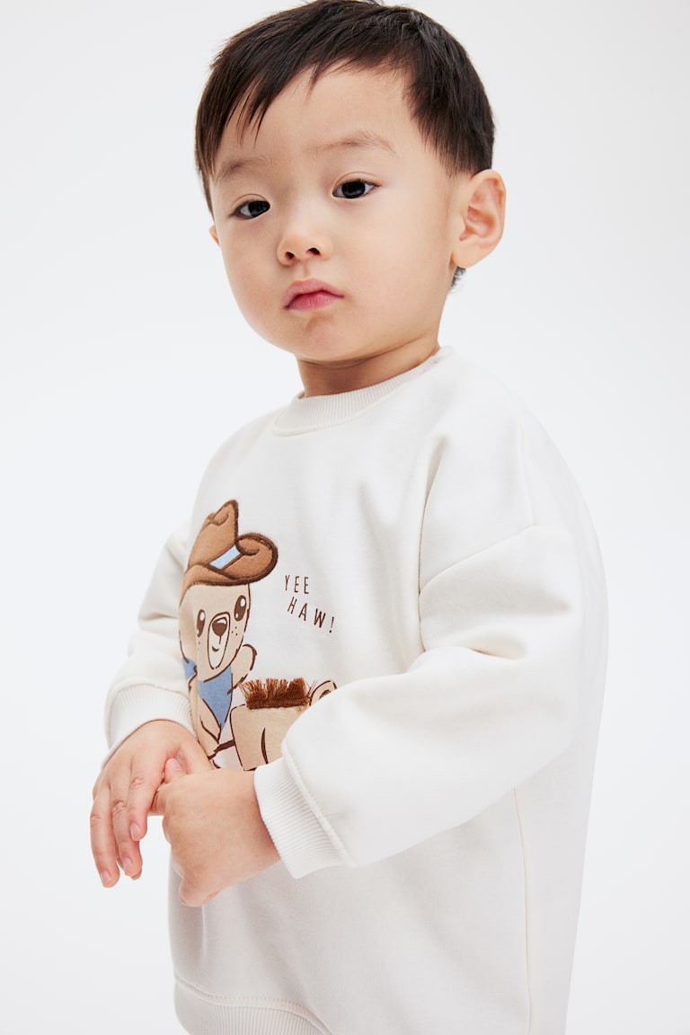 H&M Sweatshirt mit Motiv Jubiläumsangebot