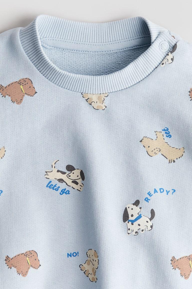 H&M Sweatshirt mit Print Große Rabatte