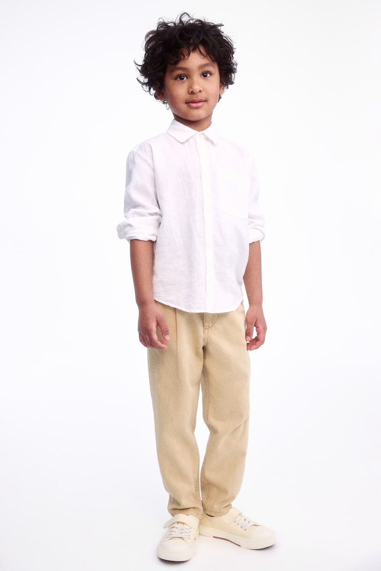 H&M Loose-fit tapered twill chinos Fabrikladen