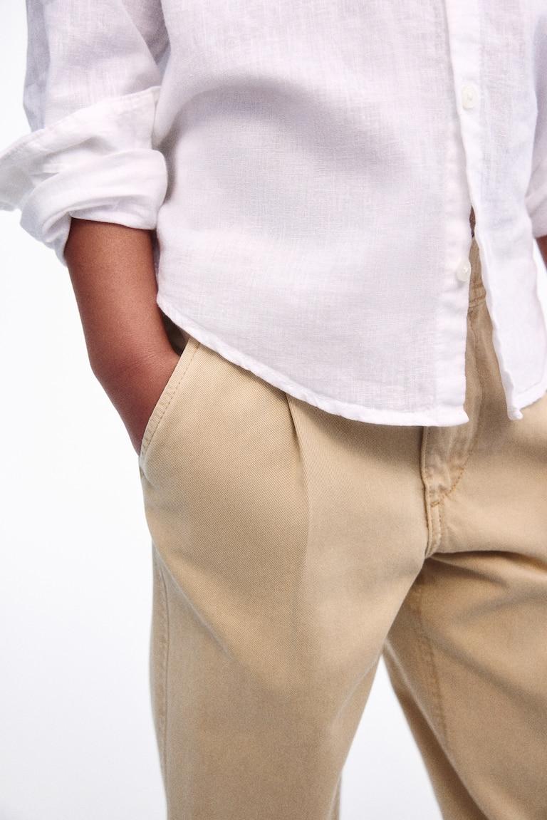 H&M Loose-fit tapered twill chinos Fabrikladen