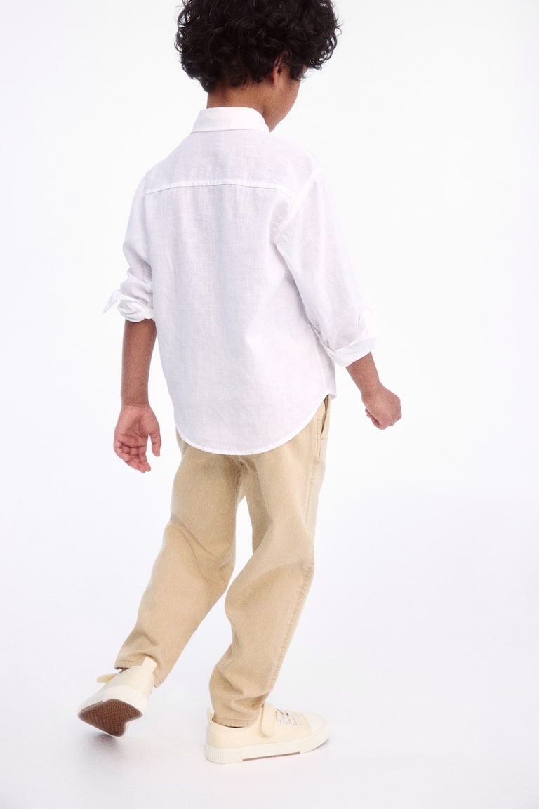 H&M Loose-fit tapered twill chinos Fabrikladen
