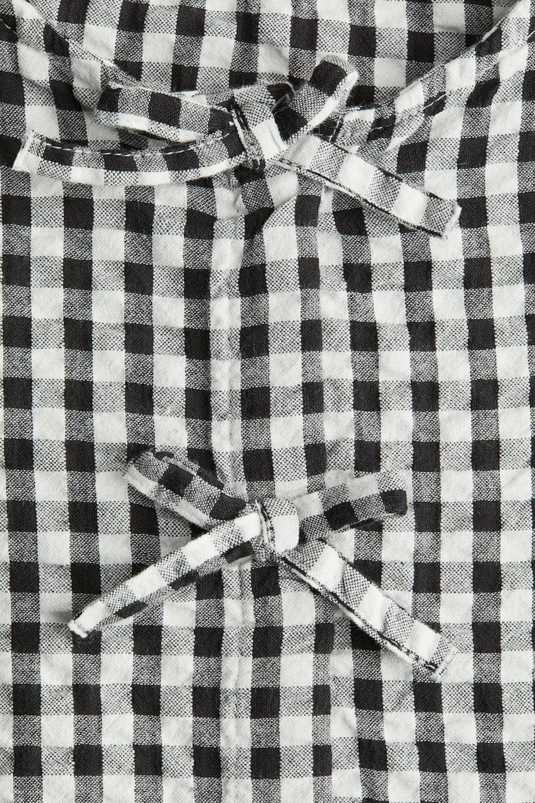 H&M Peplumbluse aus Baumwoll-Seersucker Bis zu 60% Rabatt