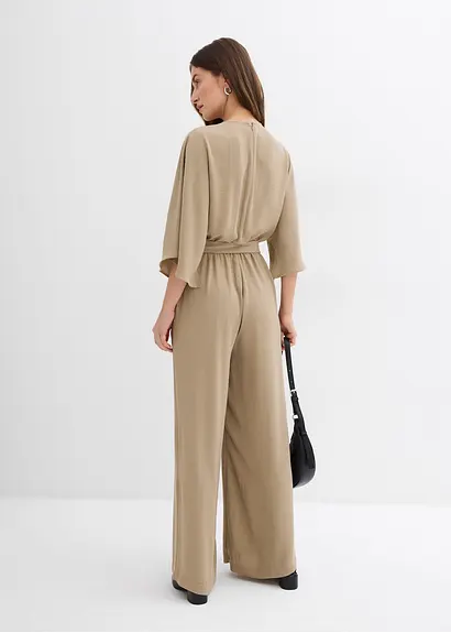 bonprix Eleganter Jumpsuit mit einem voluminösen weiten Bein einem Schlüssellochausschnitt und fließenden Cape-Ärmeln. Der farblich passende Gürtel verleiht der lockeren Silhouette mehr Definition 2025